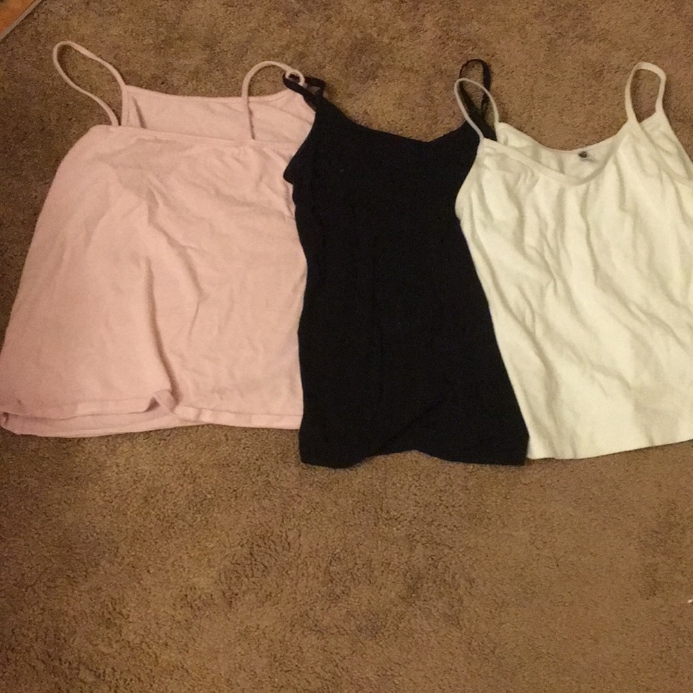 3 tank tops. Pink, Black, and White.